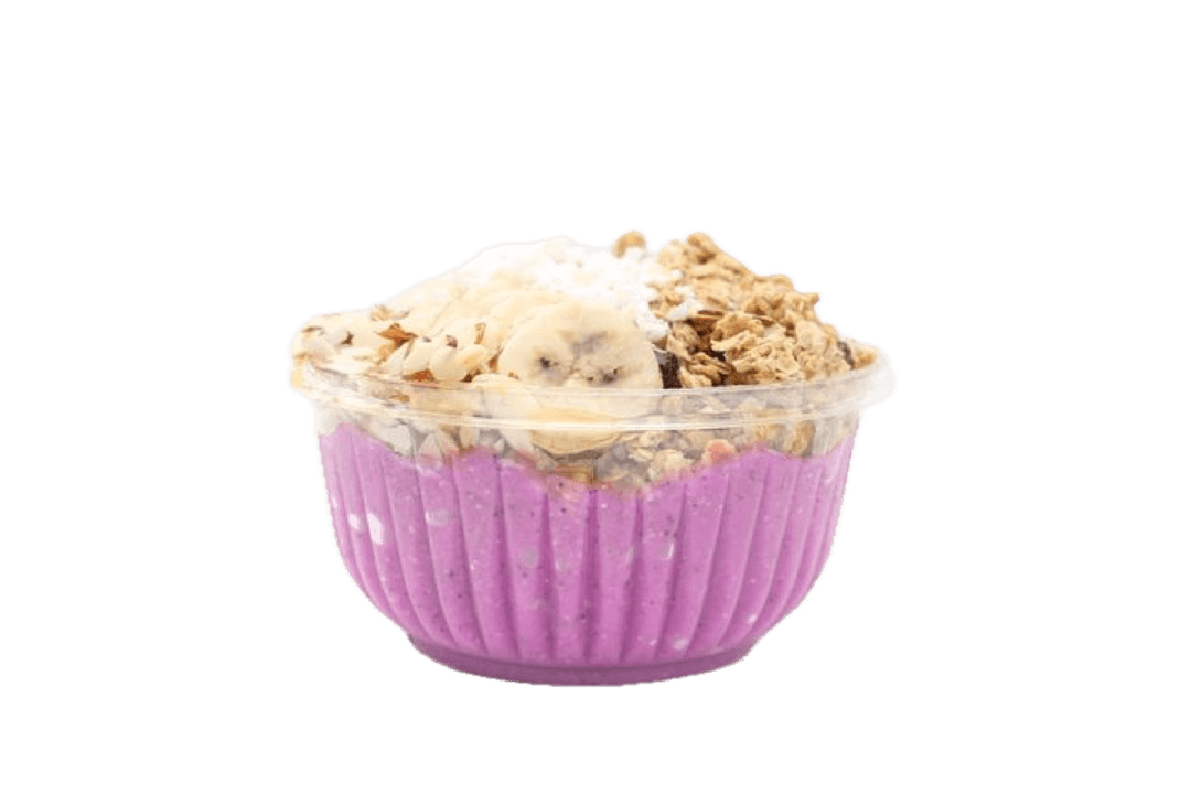 A dragonfruit bowl with banana, coconut, and granola