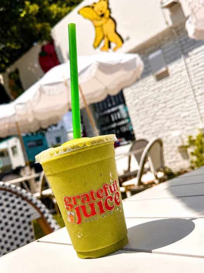 A green smoothie on the Grateful Juice patio