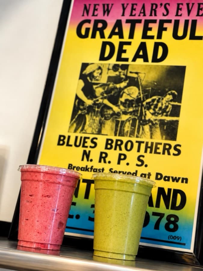 Smoothies in front of a vintage Grateful Dead concert poster